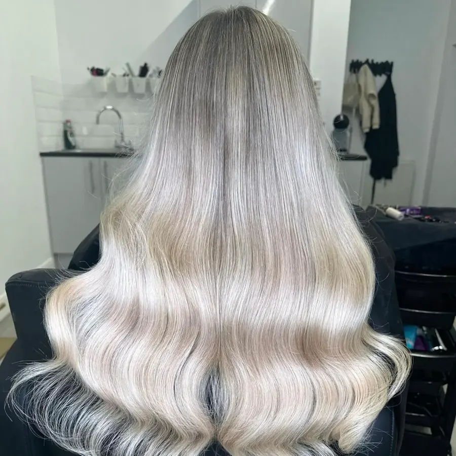Silver-blonde balayage with smooth waves