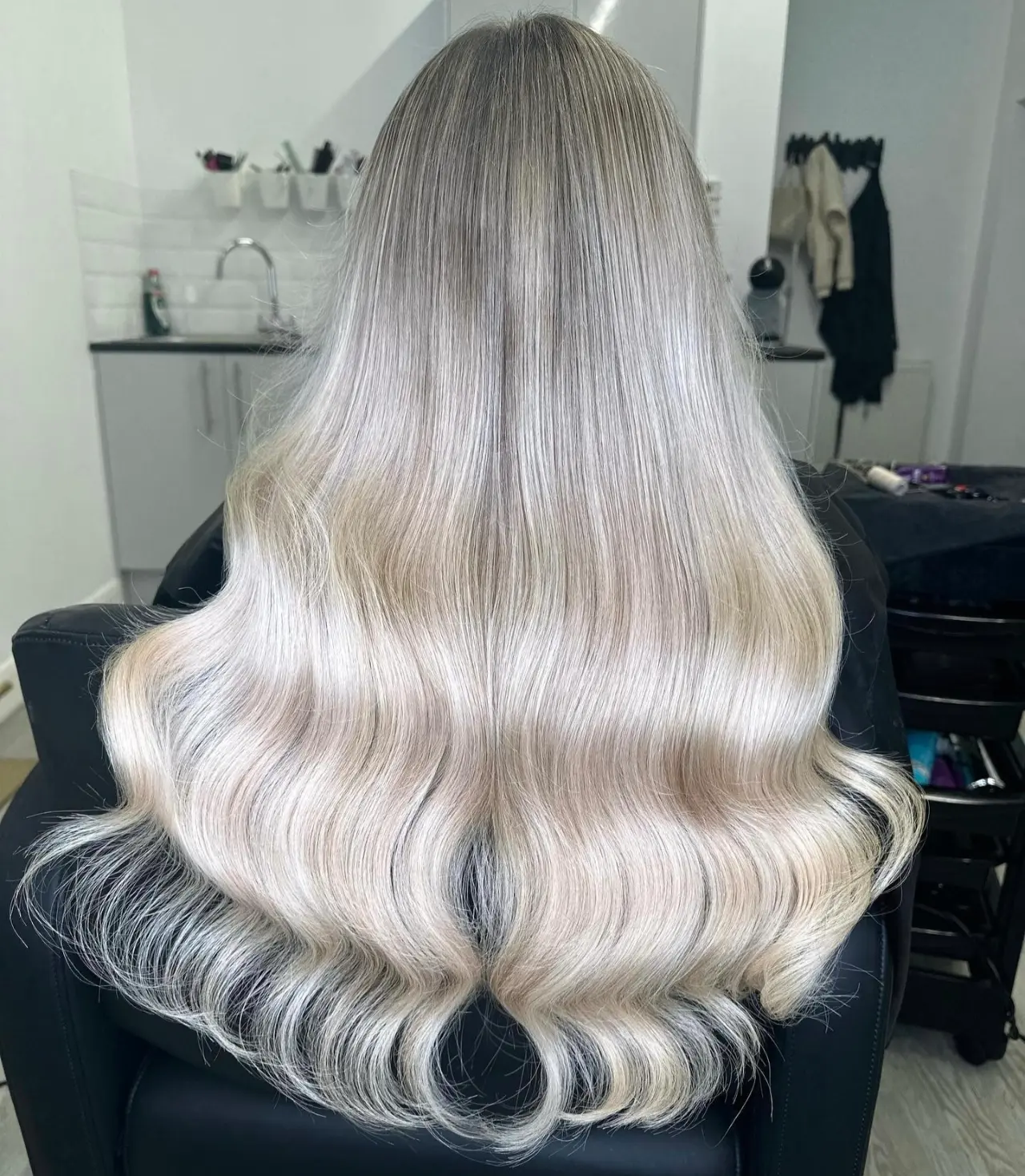 Silver-blonde balayage with soft waves