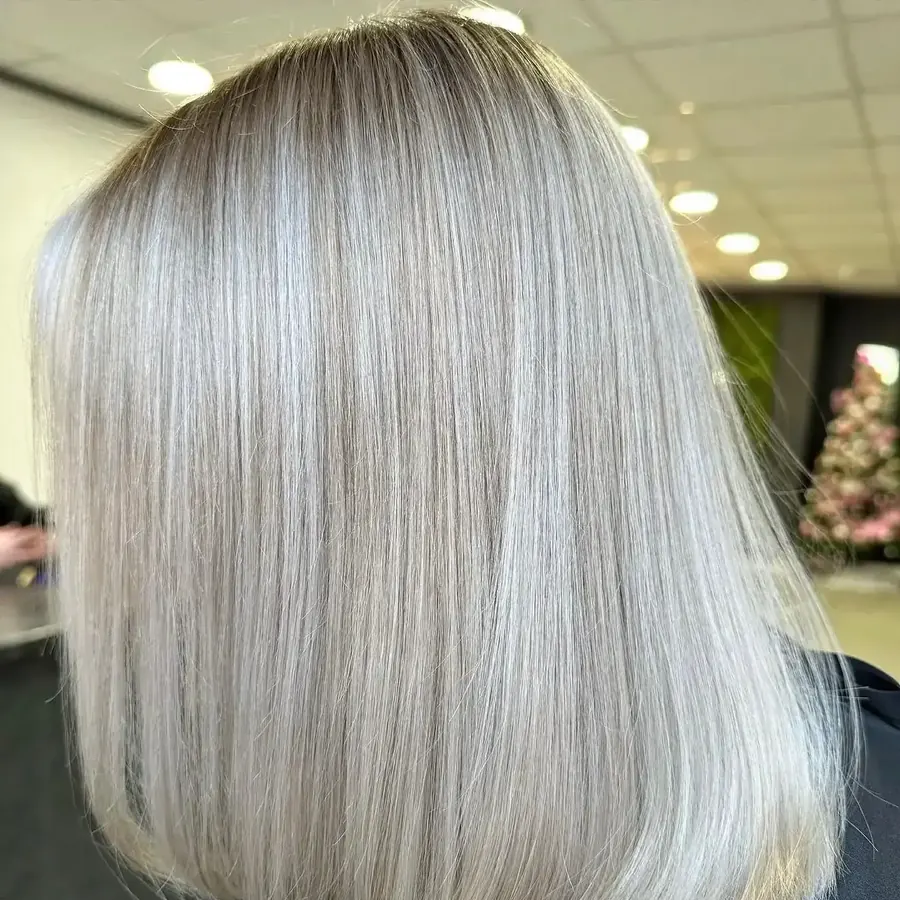 Sleek silver-blonde bob, precision cut with a glassy finish