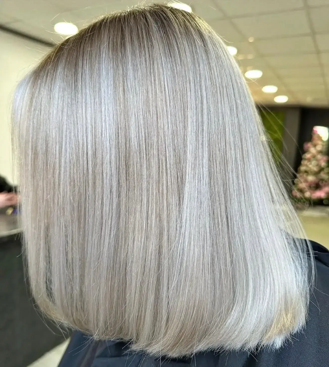 Sleek silver-blonde bob, precision cut with a glassy finish